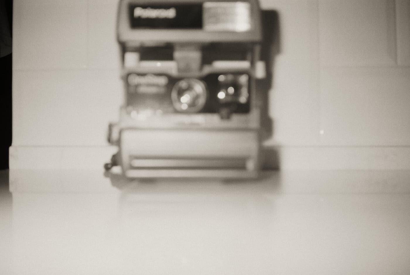 Instant film packs and a camera arranged on a kraft paper surface